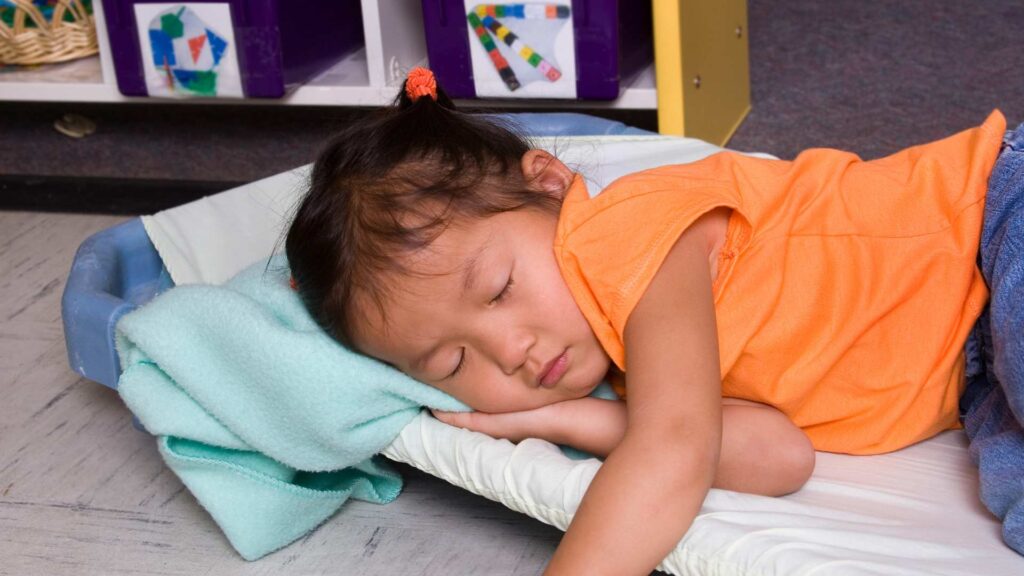 A child asleep, illustrating a calm moment to discuss autism and sleep routines