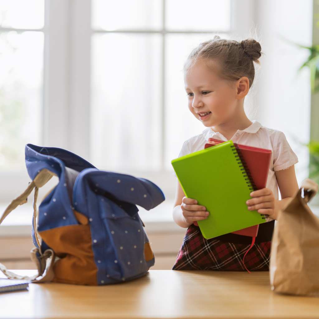 Child practicing independent self-help skills before starting kindergarten