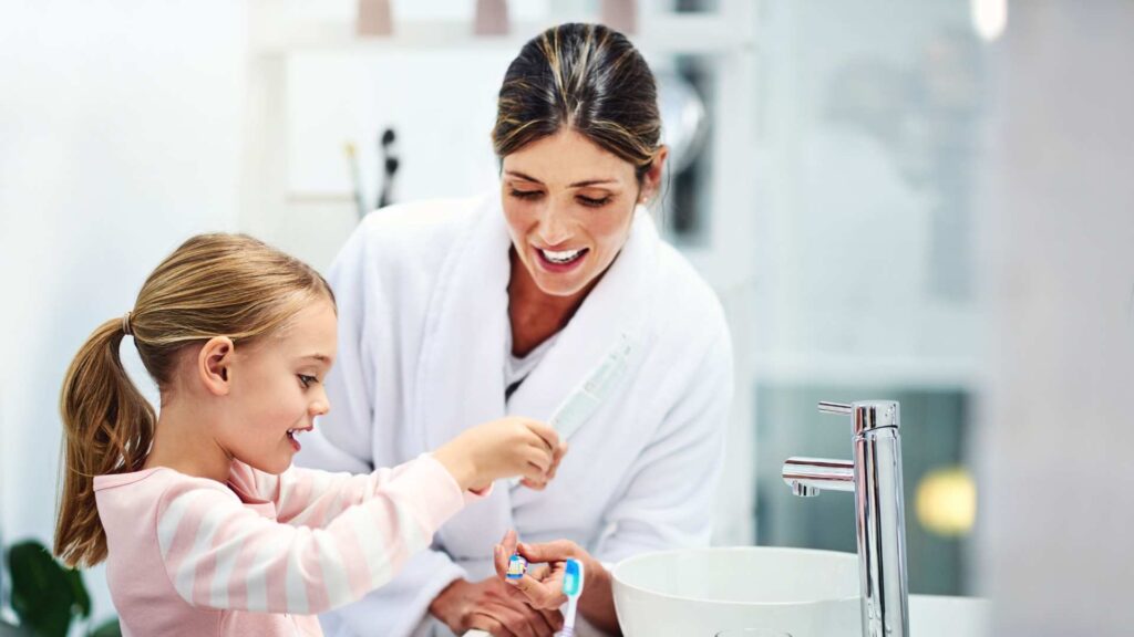Mother teaching proper hygiene skills
