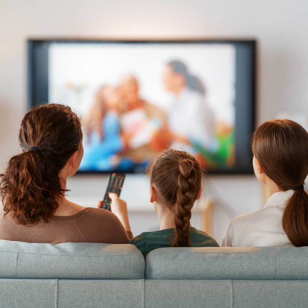 Family watching TV together, exploring TV shows with autistic characters.