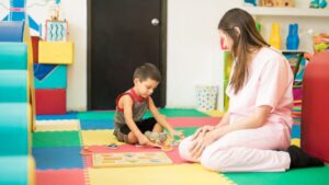 Toddler participating in ABA therapy for toddlers through play-based activities that build communication, attention, and early learning skills.