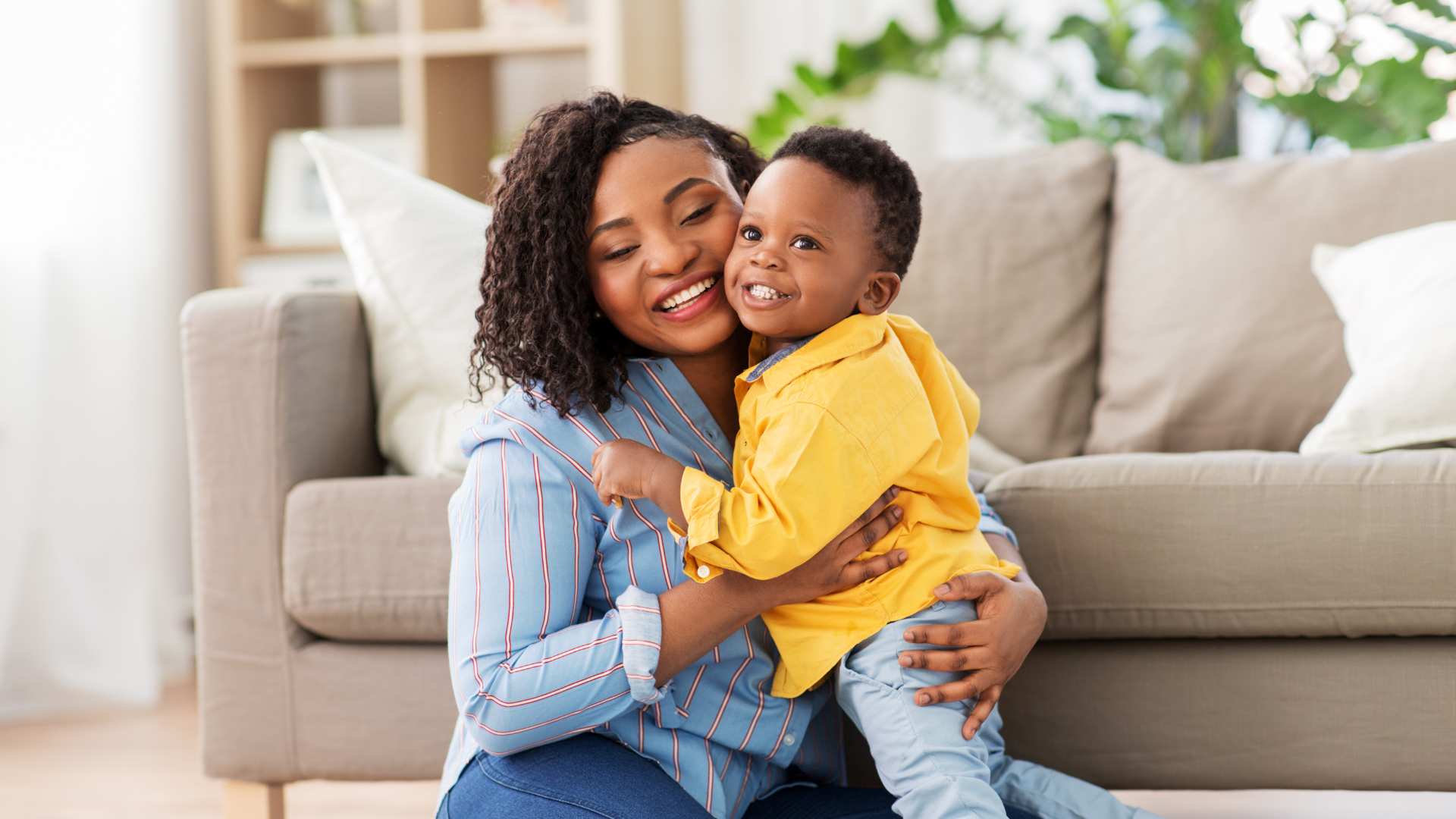 Mother parenting a child with autism hugging her smiling child