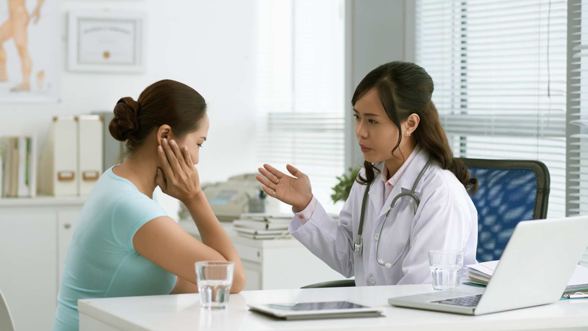 Healthcare professional speaking with a parent after a child's autism diagnosis
