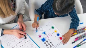 Child completing structured tasks during an autism evaluation