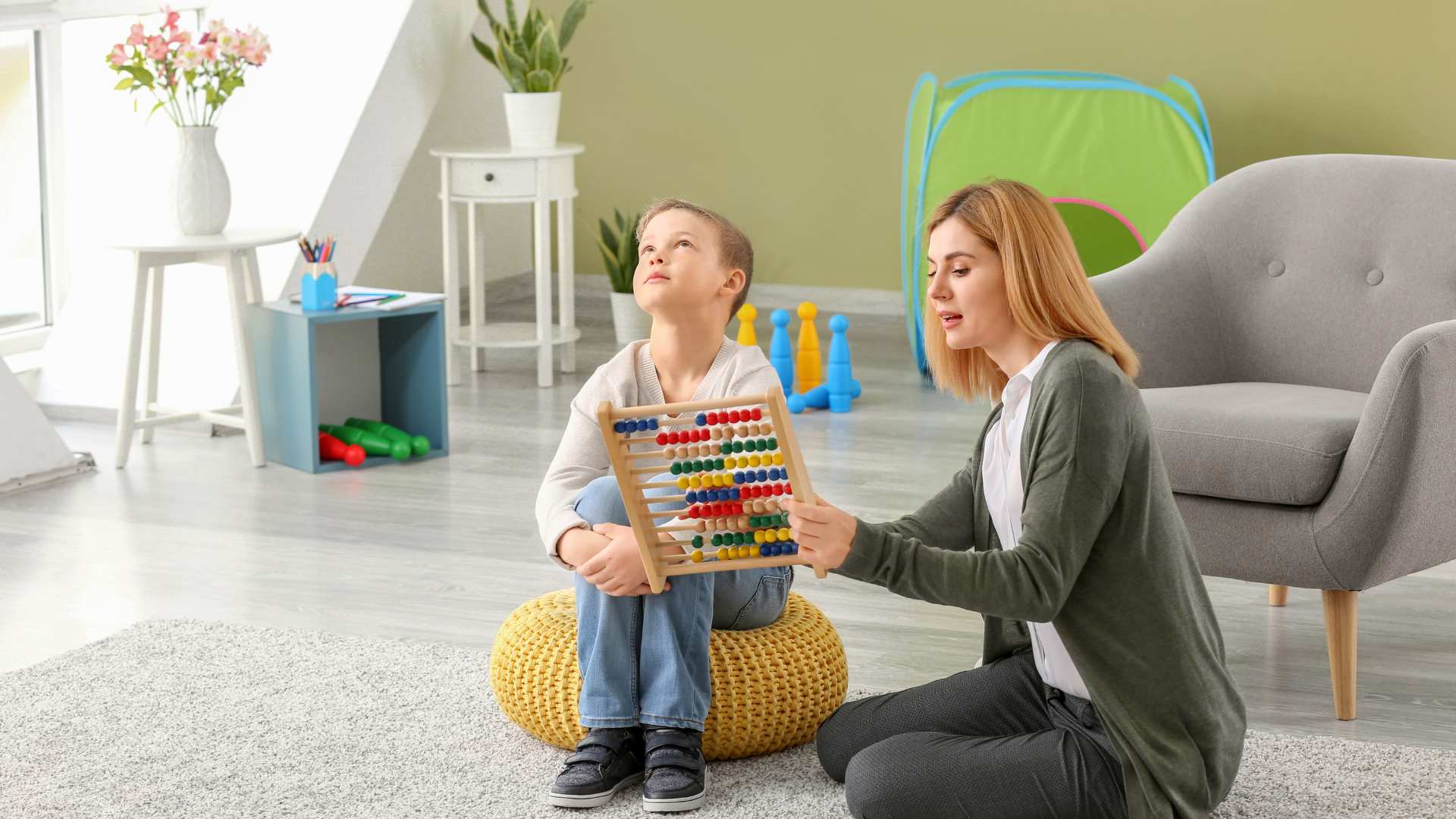 Child participating in a developmental evaluation activity with a specialist