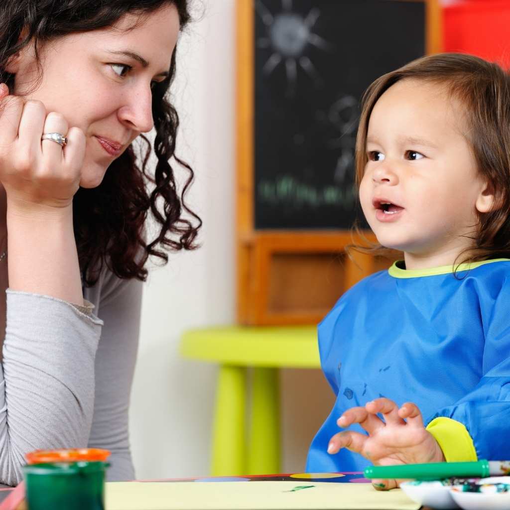 Child using speech and interaction skills during a communication-focused activity