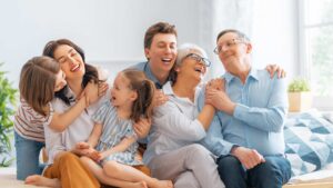 Three generations of a family sharing a joyful moment together after explaining autism to family