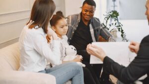 Family choosing an ABA provider discussing ABA therapy options with professional during a consultation