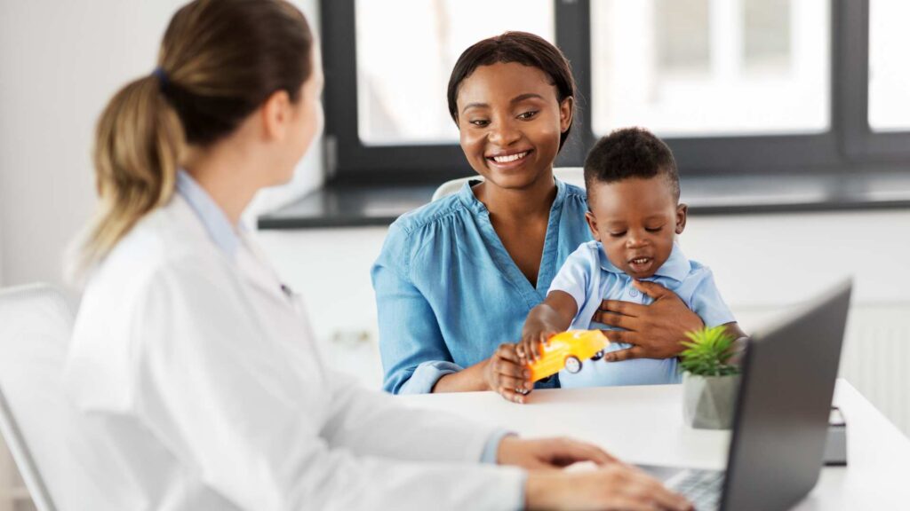 Mother and toddler attending an autism evaluation with a healthcare provider
