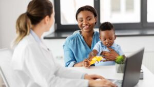 Mother and toddler attending an autism evaluation with a healthcare provider