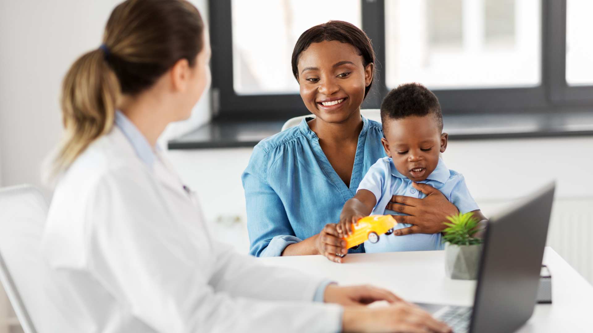 Mother and toddler attending an autism evaluation with a healthcare provider