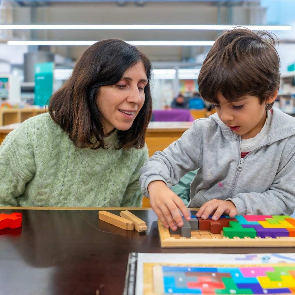 Parent and child practicing communication and problem-solving through play