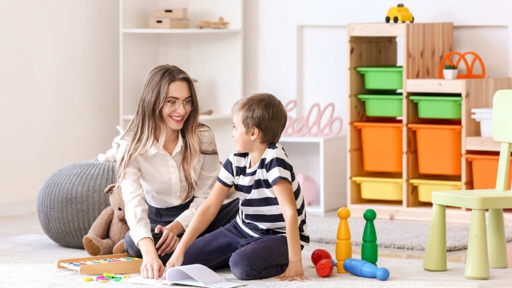 ABA therapist building rapport with a child during a therapy session, important when choosing an ABA therapy provider