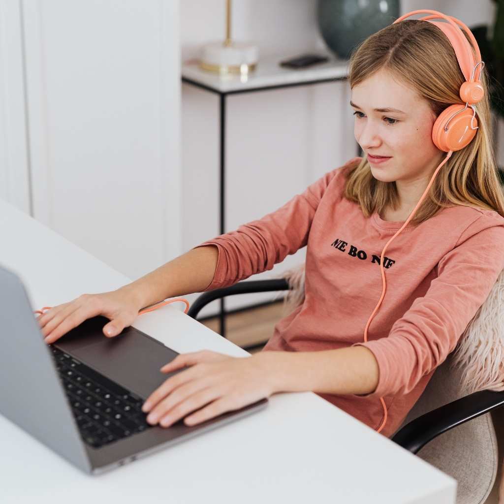 Student using headphones as a sensory accommodation for autism in school
