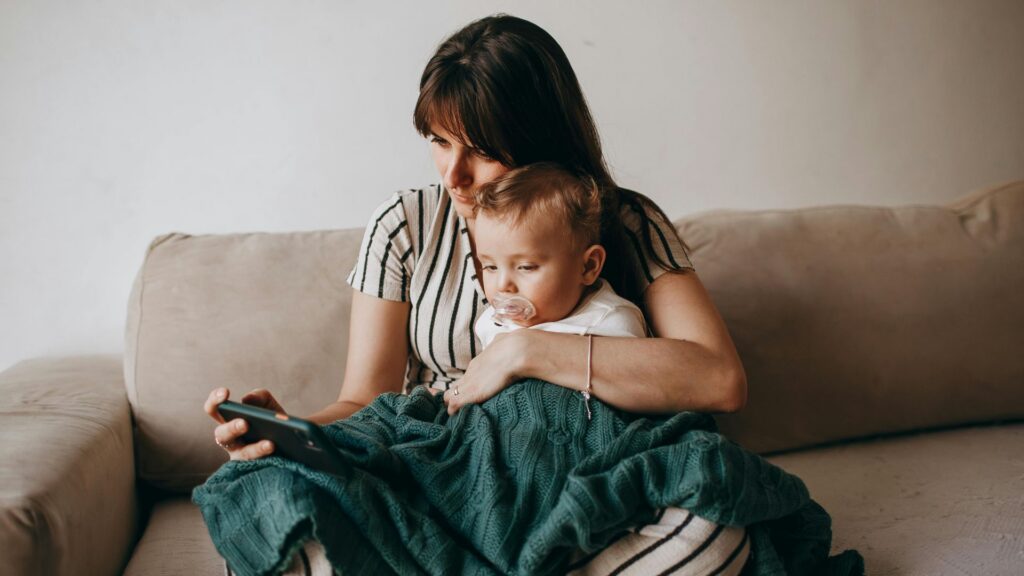 Parent comforting a young child while looking for autism resources for grief in autism