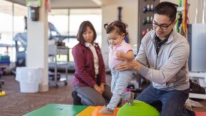 Toddler practicing balance and movement skills during ABA therapy for toddlers