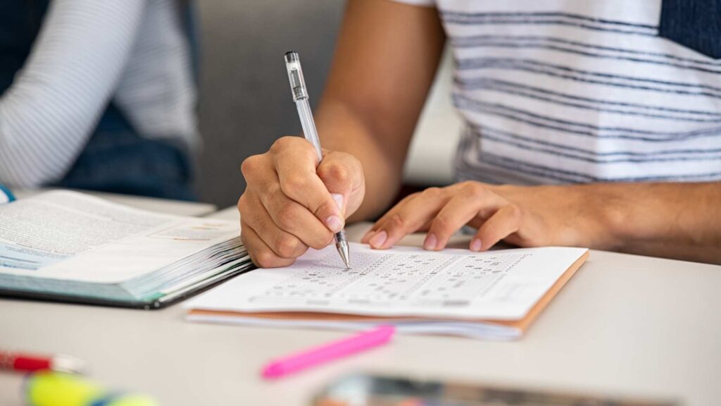 Person completing written assessment related to Board Certified Behavior Analyst qualifications